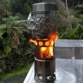 small wood buring stove used outside a nz doc hut