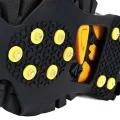 close of spikes on a hiking boot