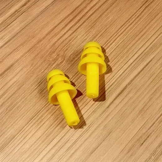 yellow silicon plugs for ears on table