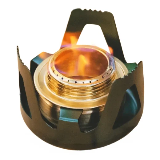Close-up of alcohol stove burner with flame visible through the metal support
