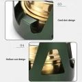 Close-up of alcohol stove metal support showing card slot and hollow cut-out design around the burner