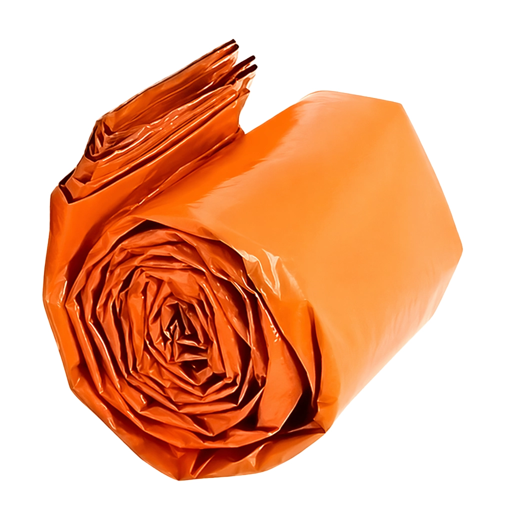 Orange survival bag rolled into a compact bundle