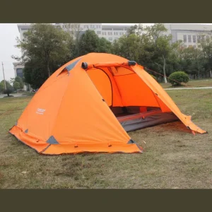 orange winter tent with snow skit used outside