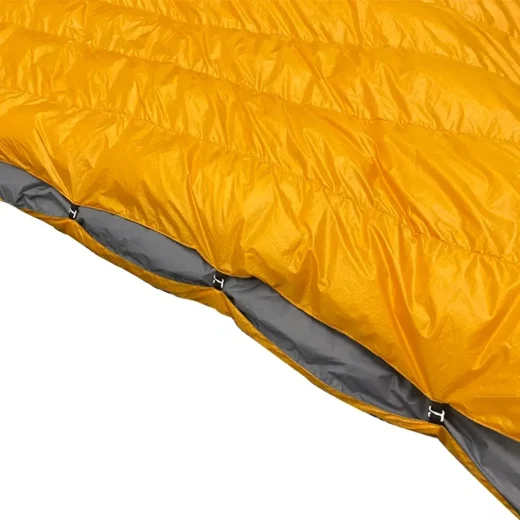 tramping quilt side catch system