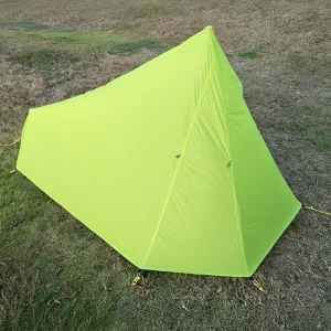 green ultralight tent on grass 2025