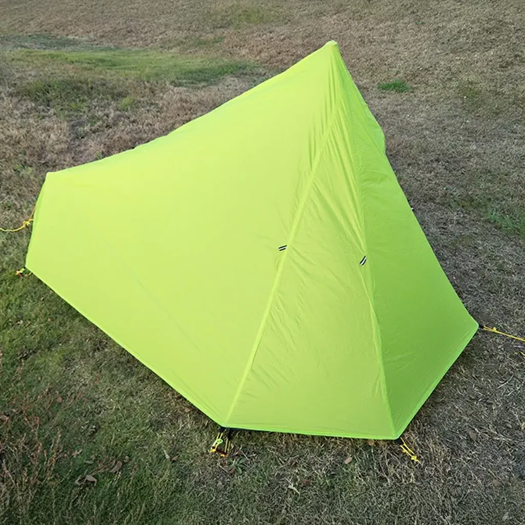 green ultralight tent on grass 2025