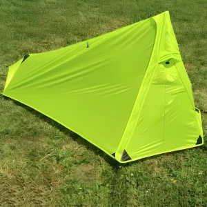 vuno ultra 1p trekking pole tent set up on the grass outside