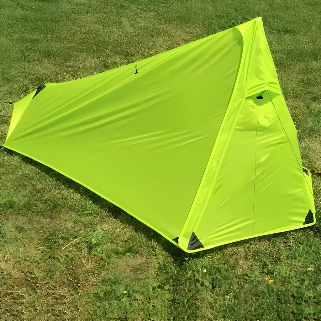 vuno ultra 1p trekking pole tent set up on the grass outside
