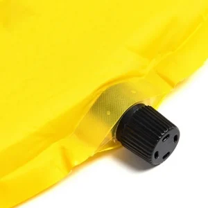inflation valve on yellow sleeping pad