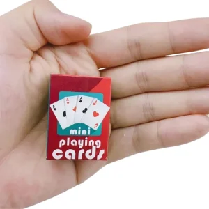 mini box of playing cards held in a hand