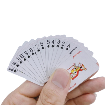 small playing cards in hand
