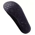 Close-up of the patterned sole on black aquatic water shoes with hexagonal and circular grip sections