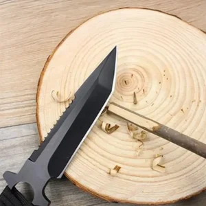 whittling with a paracord handled knife