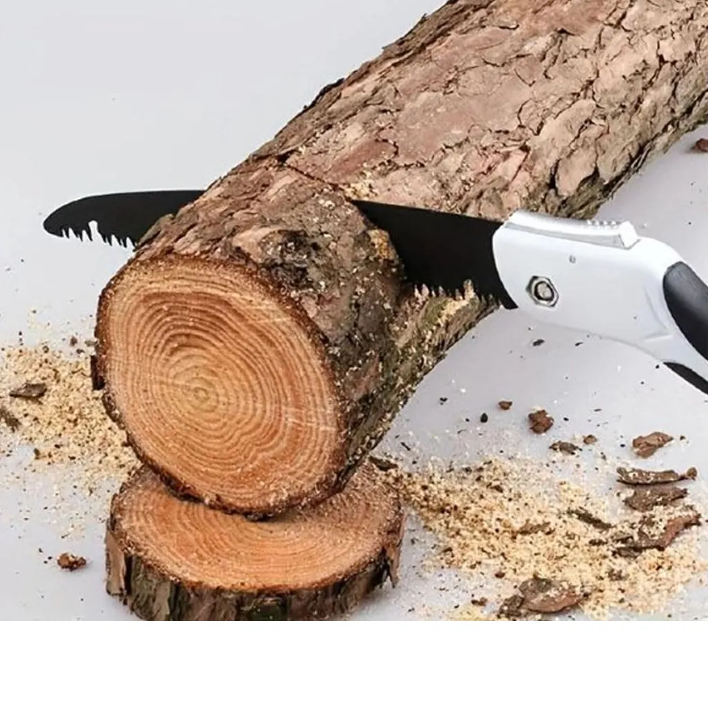 camping saw used to cut a tree branch