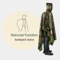 image showing camouflage rain poncho rain poncho covering backpack