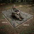 camouflage rain poncho used as a tarp