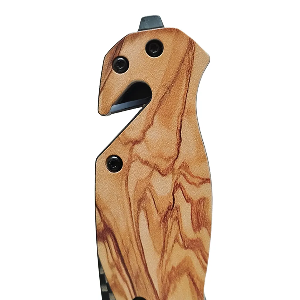 close up of glass synthetic wood grain handle of knife with emrgency glass break and belt cutter
