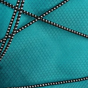 close up of waterproof backpack fabric and cargo netting for wet gear