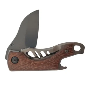 blade partly open on pocket knife with wooden handle and bottle opener