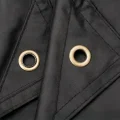 black hikera rain poncho close up of eyelet holes for using as a shelter