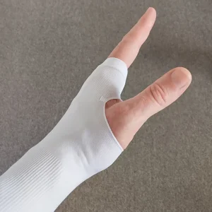 white arm sleeve with thumb hole worn to show the thumb cut out