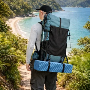 man walking the Abel Tasman track with a vuno ultralight weight backpack