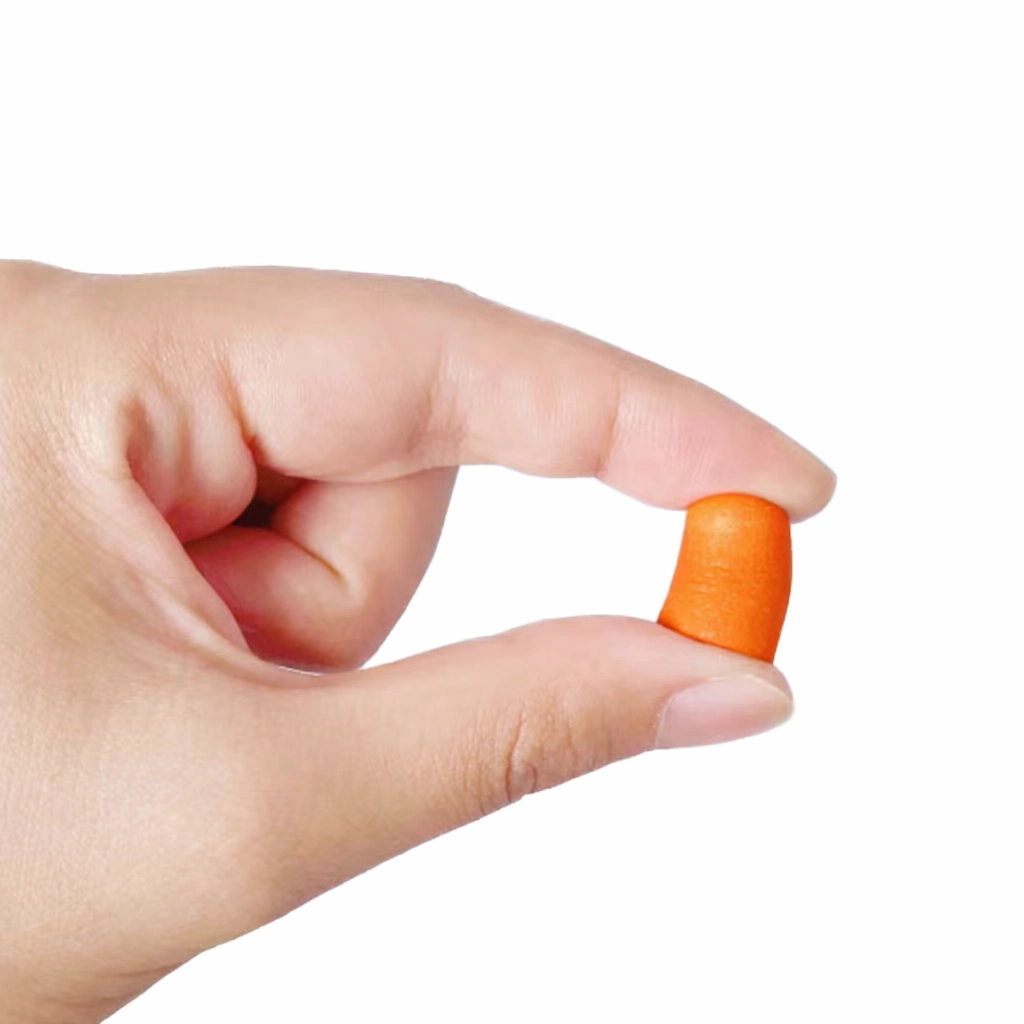 Small orange foam ear plug held between fingers to show compact size and shape