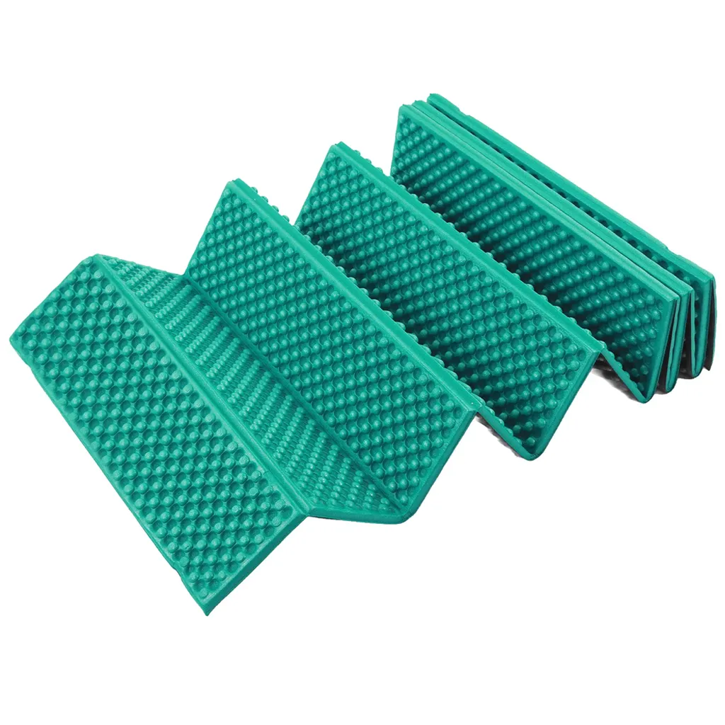 green hiking sleeping pad partially folded