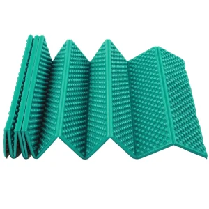 green sleeeping mat almost fully folded up