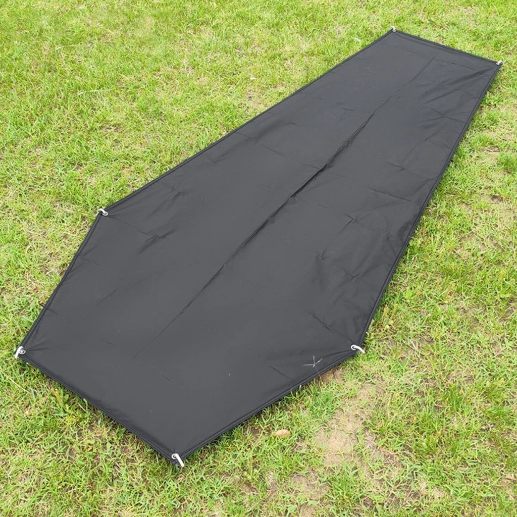 Black 210D Oxford cloth bivvy footprint on grass with metal corner eyelets for pegging
