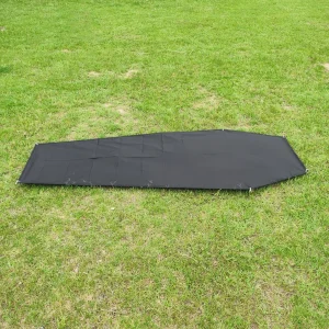 Black Footprint for Vuno Bivvy Bag spread out on grass with corner eyelets visible