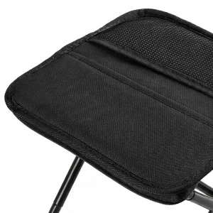 Close-up of the black fabric seat and stitched edge on a foldable stool