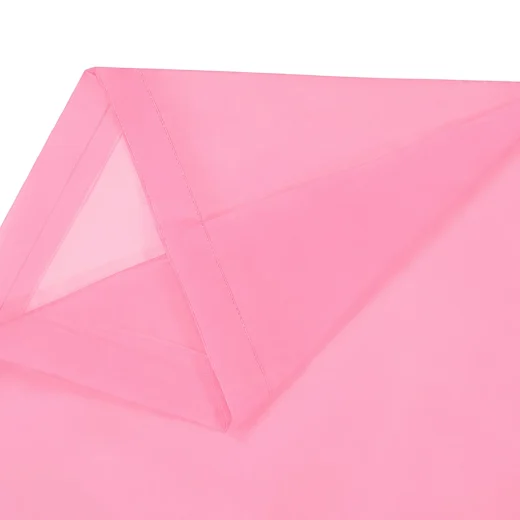 Close up of pink rain poncho side panel showing translucent EVA material and stitched edge