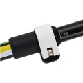 Close-up of the green trekking pole quick-lock adjustment clip and length marking