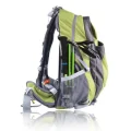 Folded green trekking pole carried in the side pocket of a hiking backpack