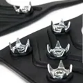 Close-up of the silver traction studs mounted in a black TPR ice grip