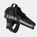 Black dog harness with name LUNA printed on the personalised side label