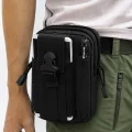 Vuno black Waist Bag Pouch worn at the waist with a cellphone in the front pocket
