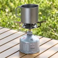 Titanium mug used as a small pot on a camping gas cooker