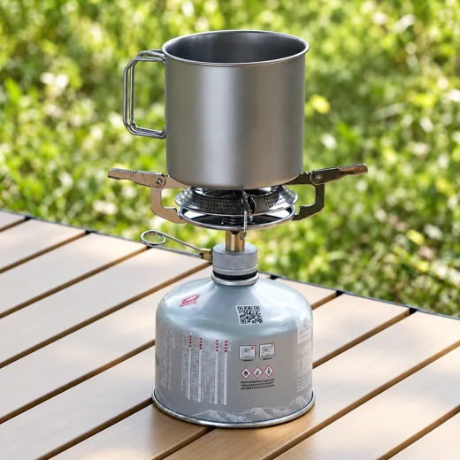 Titanium mug used as a small pot on a camping gas cooker