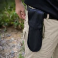 spade store in a pouch attached to a belt