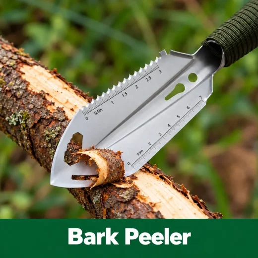 survival tool spade used to peel bark from a branch